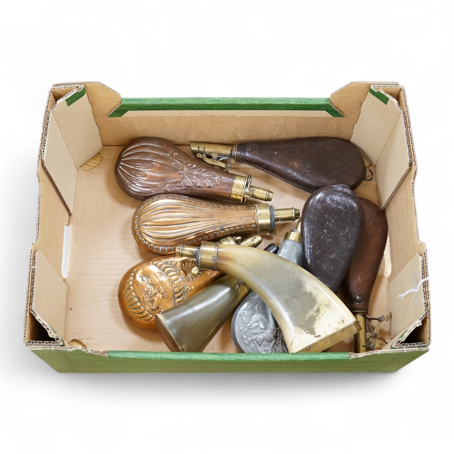 Nine powder flasks and shot flasks, all 19th century, comprising of two horn flasks, one flattened with brass mounts, three shot bags with sprung brass chargers, three copper gun flasks and another of zinc